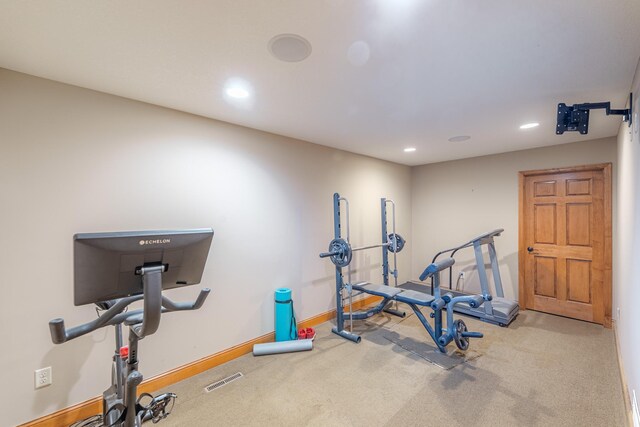 exercise area featuring visible vents, recessed lighting, carpet, and baseboards