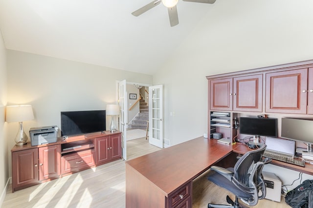 office with high vaulted ceiling, light wood-style floors, and a ceiling fan