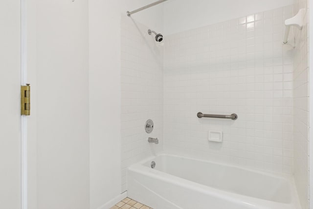 bathroom with tile patterned flooring and shower / bath combination