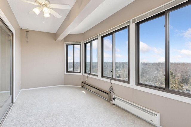 unfurnished sunroom featuring baseboard heating and ceiling fan