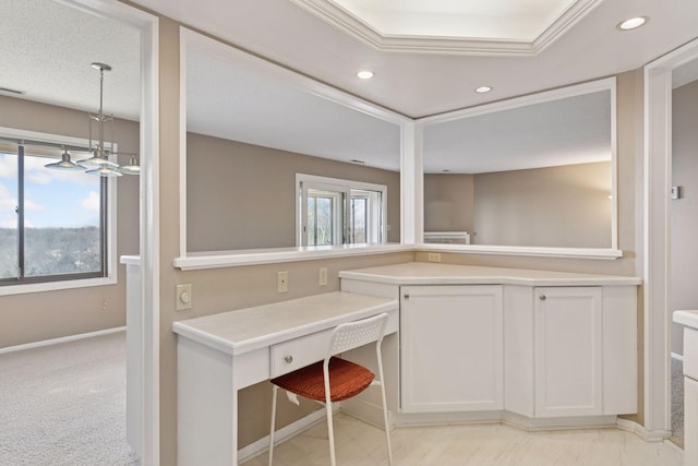 kitchen featuring recessed lighting, light countertops, and baseboards