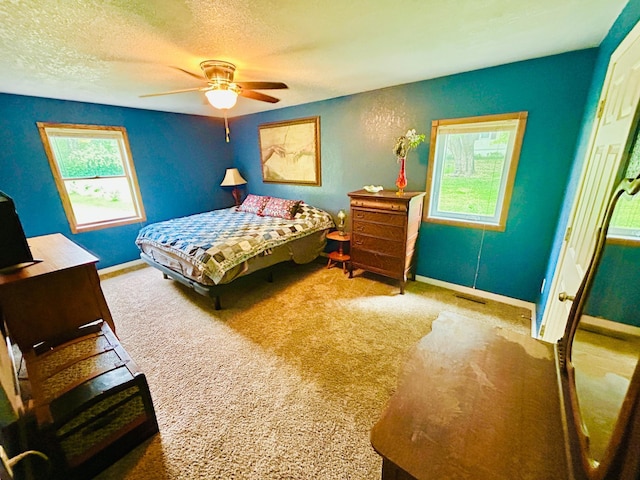 1789 Glynview Trl, Faribault, MN 55021 - carpeted bedroom featuring a textured ceiling, baseboards, and a ceiling fan
