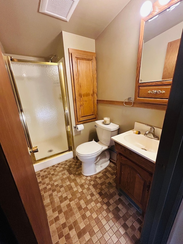 1789 Glynview Trl, Faribault, MN 55021 - full bathroom featuring a shower stall, vanity, toilet, and tile patterned floors