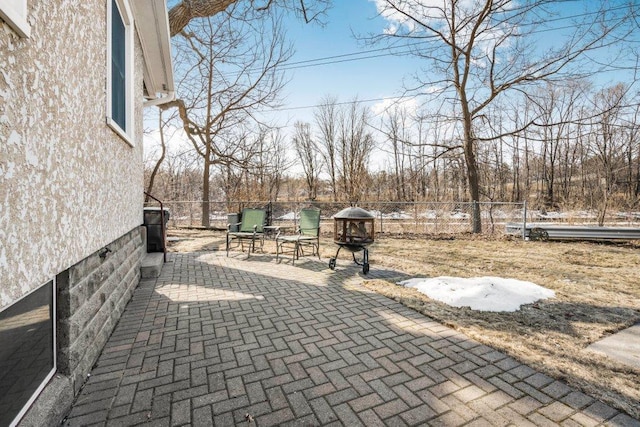 view of patio / terrace featuring fence