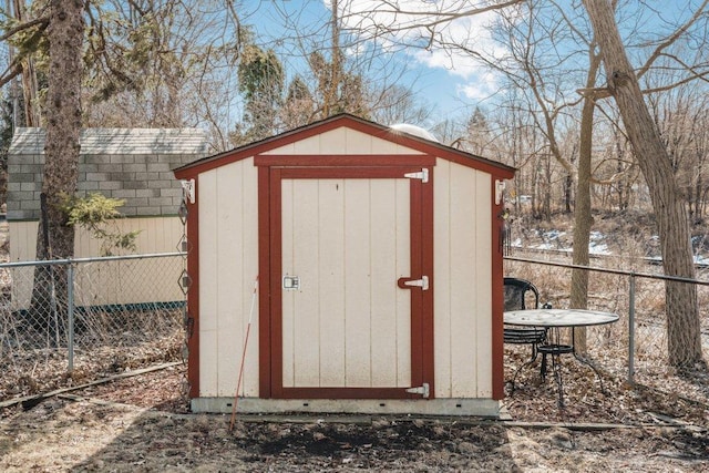 view of shed with fence