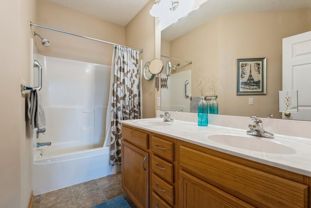 full bath with a textured ceiling, double vanity, shower / bathtub combination with curtain, and a sink