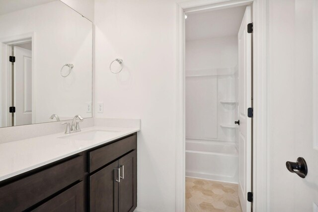 full bathroom featuring  shower combination and vanity