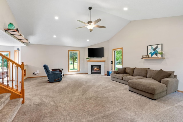 living room with carpet flooring, plenty of natural light, and ceiling fan