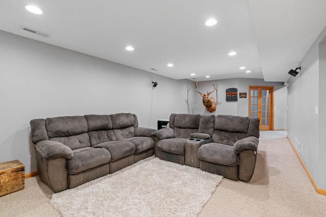 living room with visible vents, baseboards, light carpet, recessed lighting, and french doors