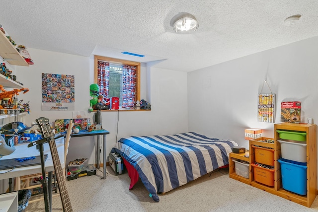 carpeted bedroom with a textured ceiling