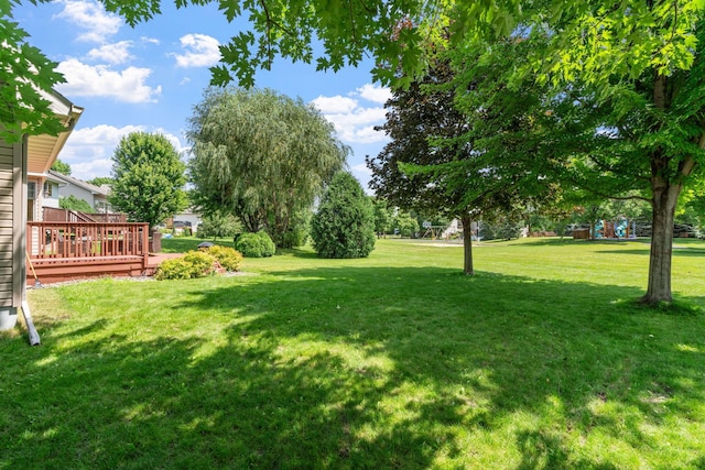 view of yard featuring a wooden deck