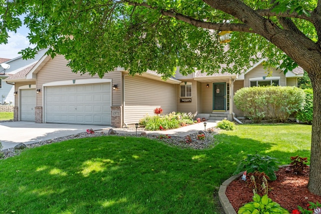 single story home featuring an attached garage, concrete driveway, and a front lawn