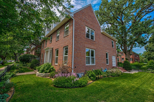 355 Laurel Ave, Saint Paul, MN 55102 - view of property exterior with brick siding and a lawn