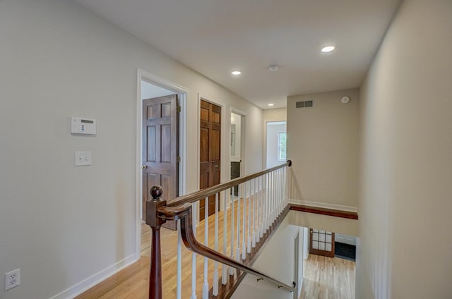 355 Laurel Ave, Saint Paul, MN 55102 - corridor featuring an upstairs landing, light wood-style floors, and recessed lighting