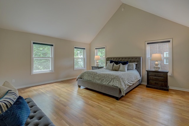 355 Laurel Ave, Saint Paul, MN 55102 - bedroom with high vaulted ceiling and light wood-style floors