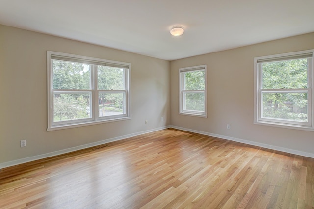 355 Laurel Ave, Saint Paul, MN 55102 - unfurnished room featuring light wood-type flooring and baseboards
