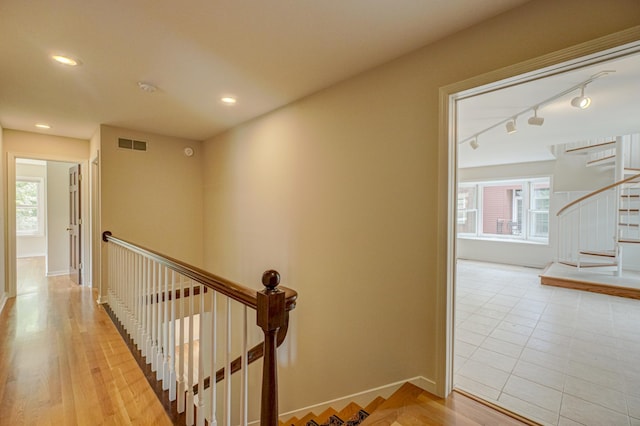 355 Laurel Ave, Saint Paul, MN 55102 - hall with rail lighting, healthy amount of natural light, an upstairs landing, recessed lighting, and light wood-style floors