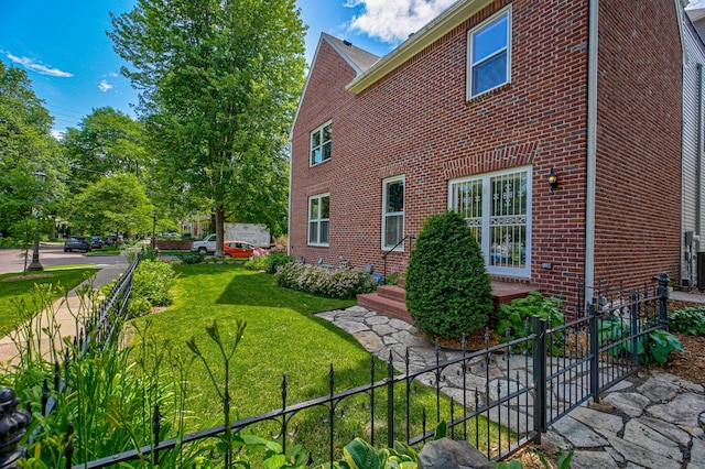 355 Laurel Ave, Saint Paul, MN 55102 - view of home's exterior featuring brick siding and a yard
