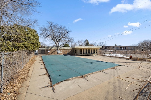 view of pool featuring a patio area, fence, and a fenced in pool