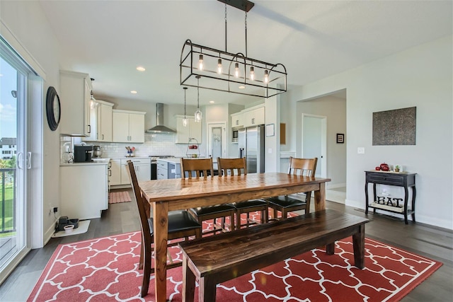 dining space featuring dark wood-type flooring, recessed lighting, and baseboards