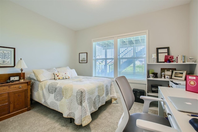 bedroom featuring light colored carpet