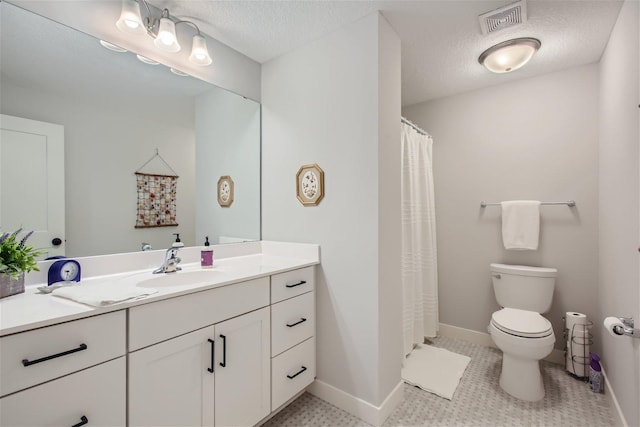 bathroom with visible vents, toilet, a textured ceiling, vanity, and baseboards