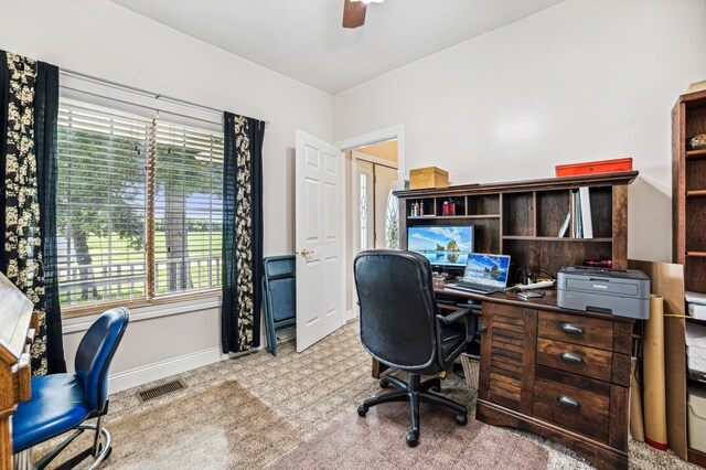 office featuring ceiling fan, visible vents, and baseboards