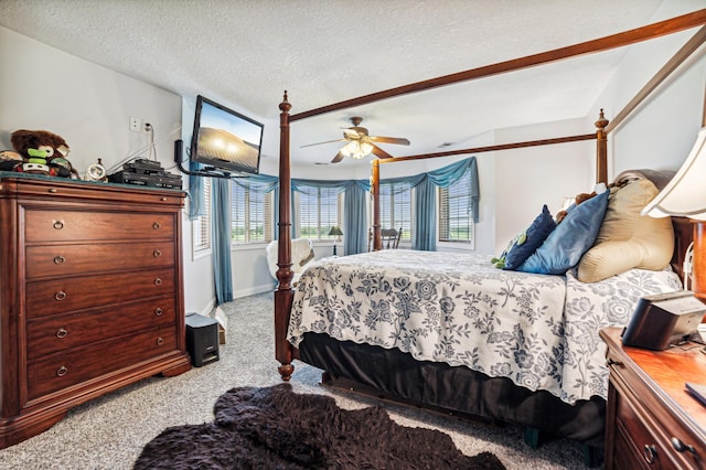 bedroom featuring carpet, ceiling fan, a textured ceiling, and baseboards