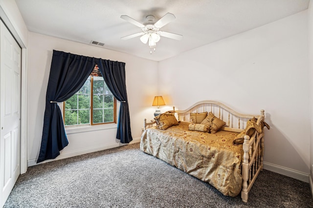 bedroom with a ceiling fan, carpet, visible vents, and baseboards