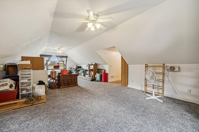 additional living space with a ceiling fan, carpet, vaulted ceiling, and baseboards