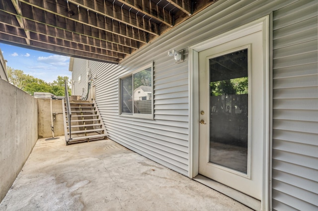 view of patio featuring fence