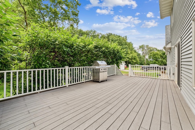 wooden terrace featuring area for grilling