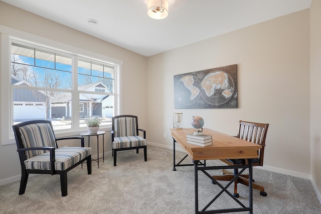 office area with light carpet and baseboards