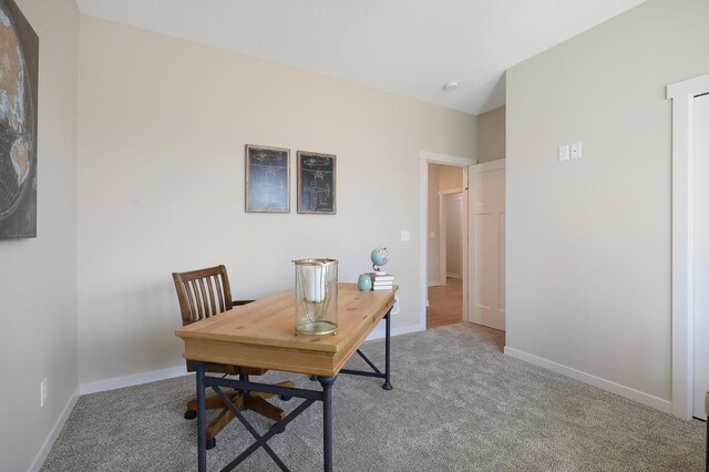 office space featuring carpet and baseboards