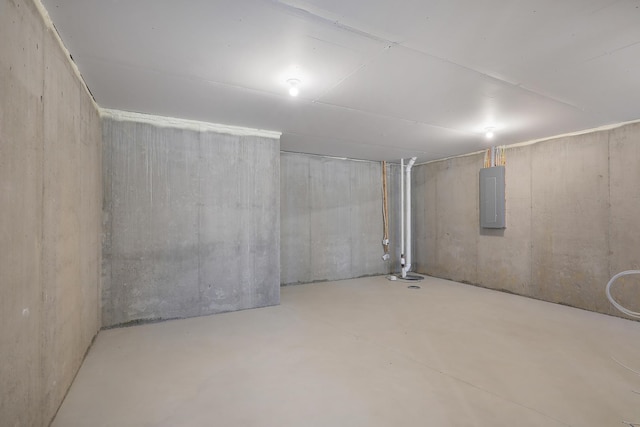 unfinished basement featuring electric panel