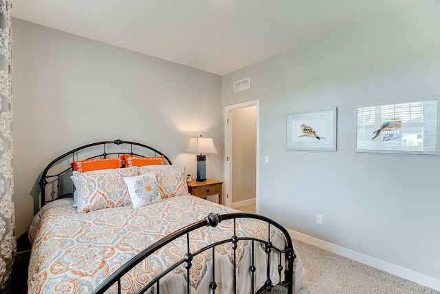 bedroom with carpet flooring, baseboards, and visible vents