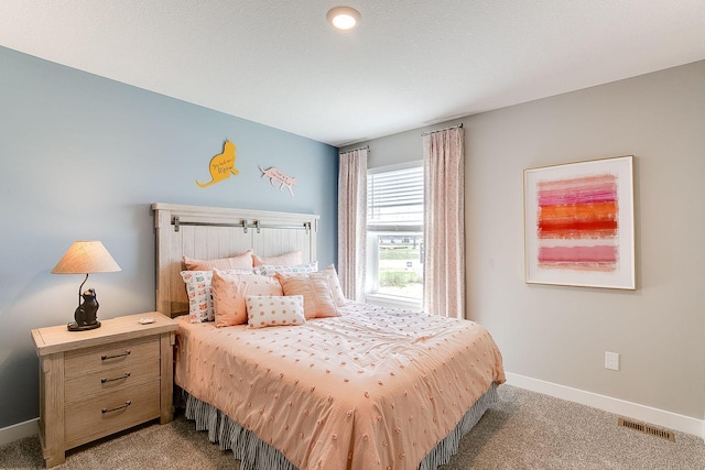 bedroom featuring visible vents, carpet flooring, and baseboards