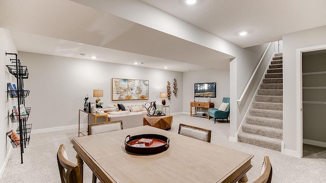 carpeted dining area featuring stairs, recessed lighting, and baseboards