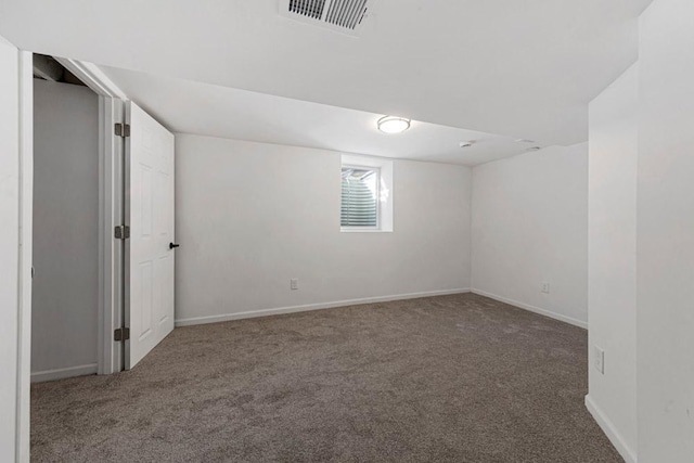 interior space featuring baseboards, visible vents, and carpet flooring