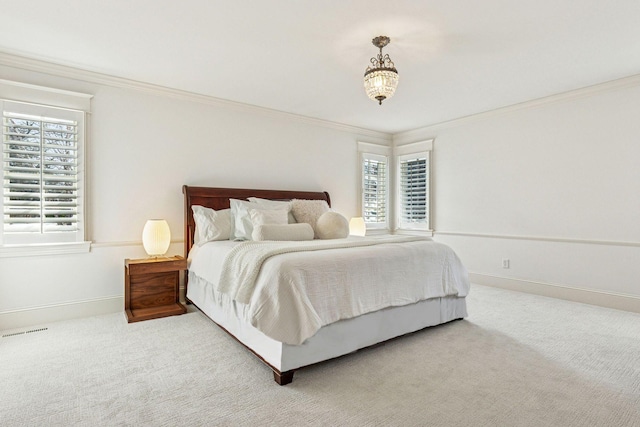 bedroom with visible vents, carpet, baseboards, and ornamental molding