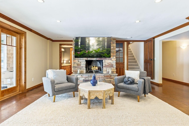 living room with stairway, a fireplace, baseboards, and ornamental molding