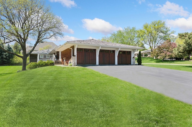 6601 Dovre Dr, Edina, MN 55436 - view of front facade with a front lawn, an attached garage, and driveway