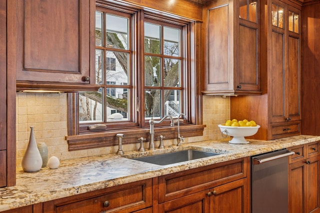6601 Dovre Dr, Edina, MN 55436 - kitchen featuring a sink, tasteful backsplash, dishwasher, and light stone countertops