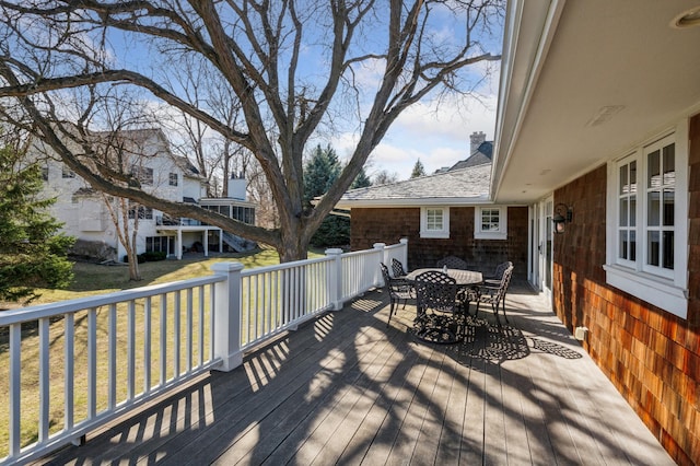 6601 Dovre Dr, Edina, MN 55436 - wooden deck featuring outdoor dining space and a yard