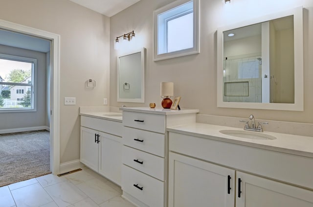 full bath with a stall shower, baseboards, visible vents, marble finish floor, and vanity