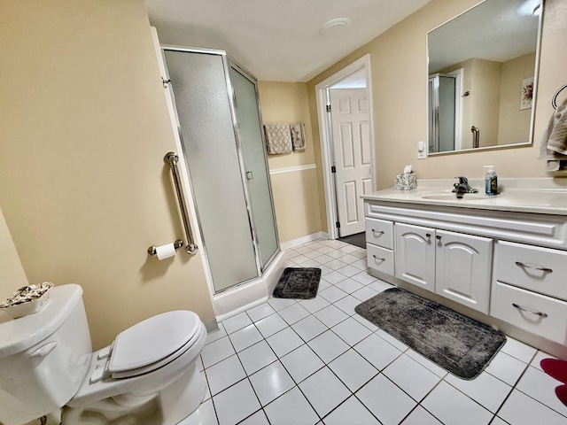 full bath featuring toilet, vanity, baseboards, tile patterned floors, and a stall shower