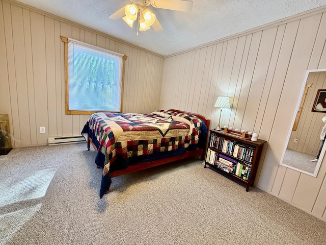 carpeted bedroom with a baseboard radiator, crown molding, ceiling fan, and a textured ceiling