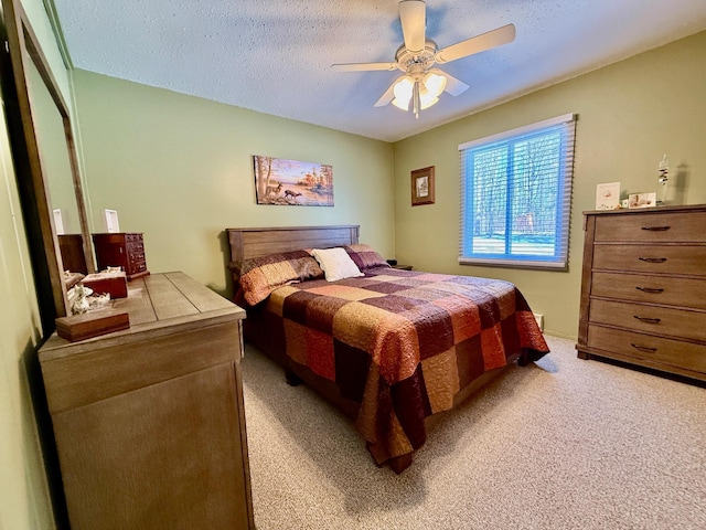 45936 State Highway 65, Mcgregor, MN 55760 - bedroom featuring light colored carpet, ceiling fan, and a textured ceiling