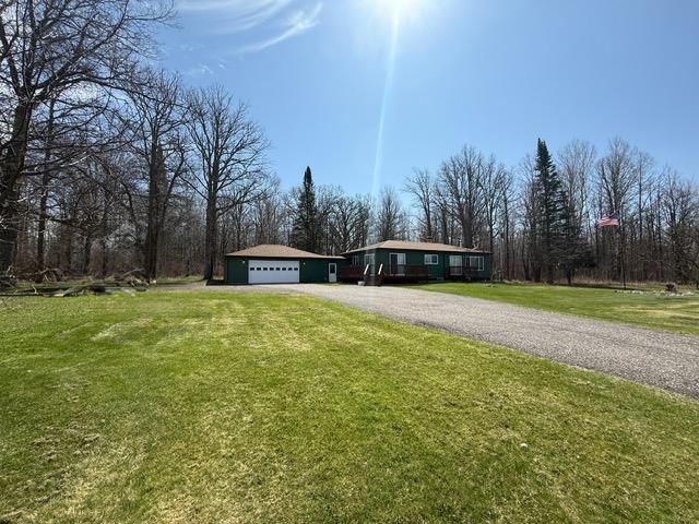 45936 State Highway 65, Mcgregor, MN 55760 - view of front of property with driveway, a front yard, and a garage