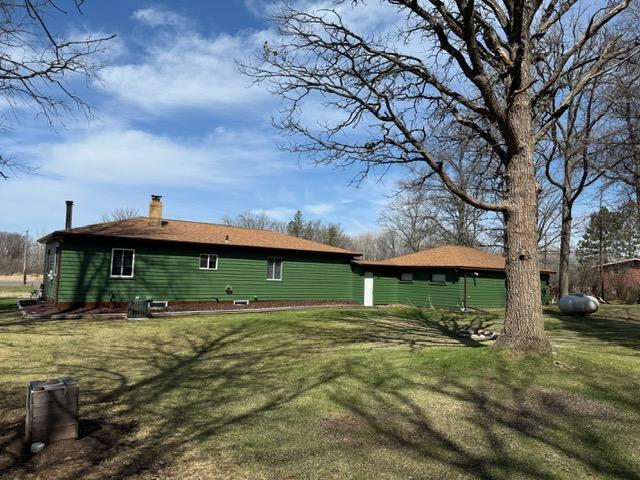 45936 State Highway 65, Mcgregor, MN 55760 - back of property featuring a chimney and a yard